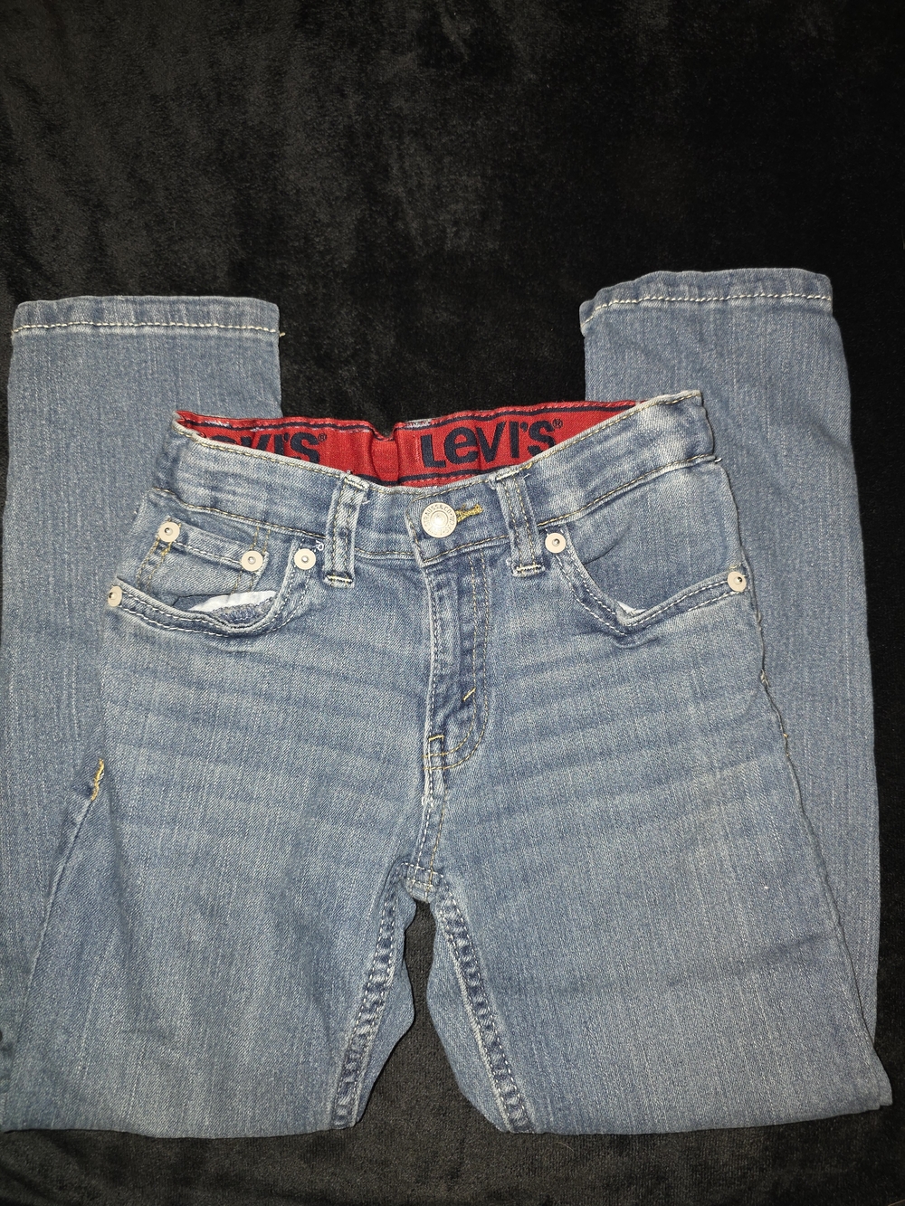 Levi's Light Blue Denim Jeans with Red Waistband Branding
